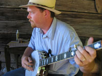 man plays banjo